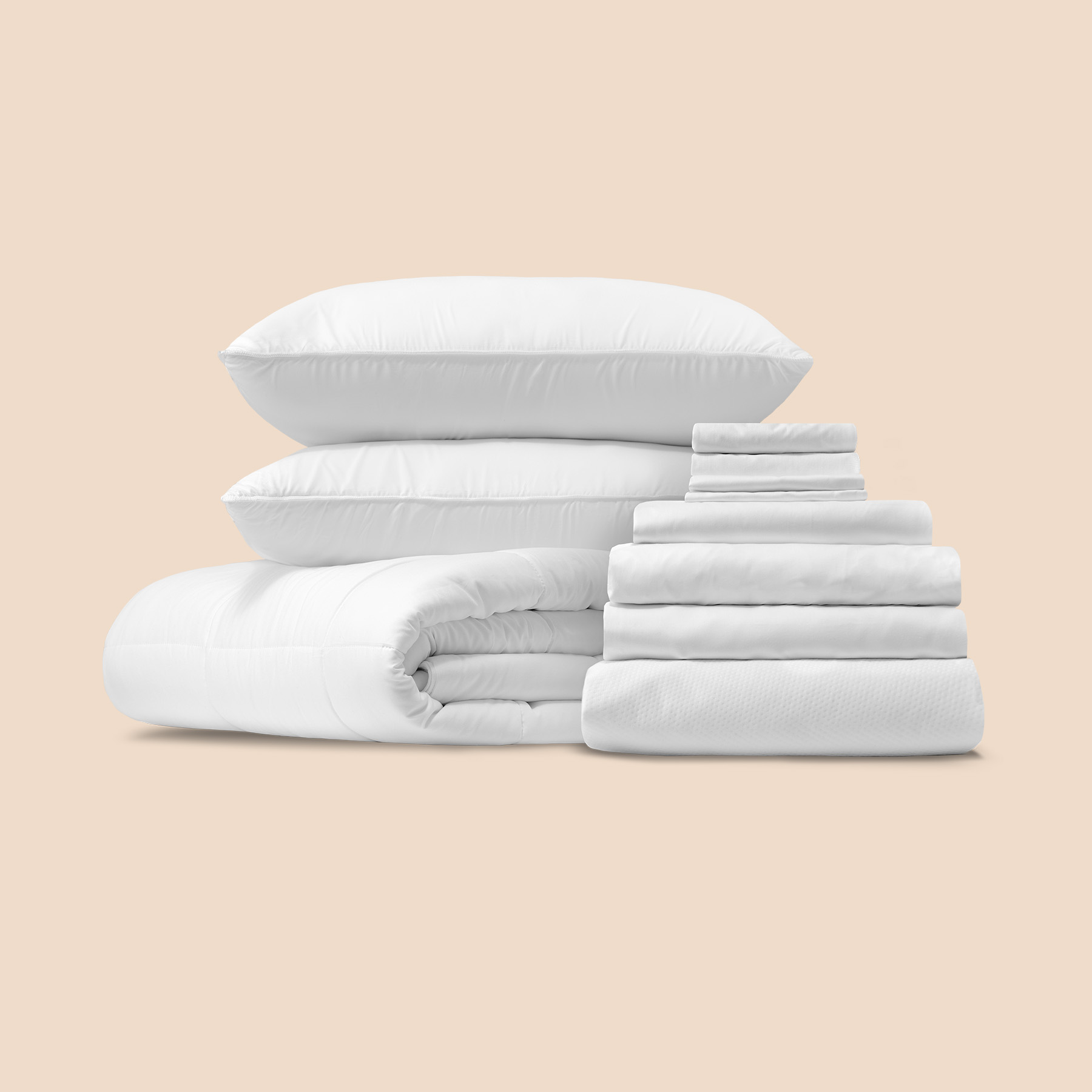 The Logan & Cove Comfort Sleep Bundle, featuring a pile of soft, inviting bedding