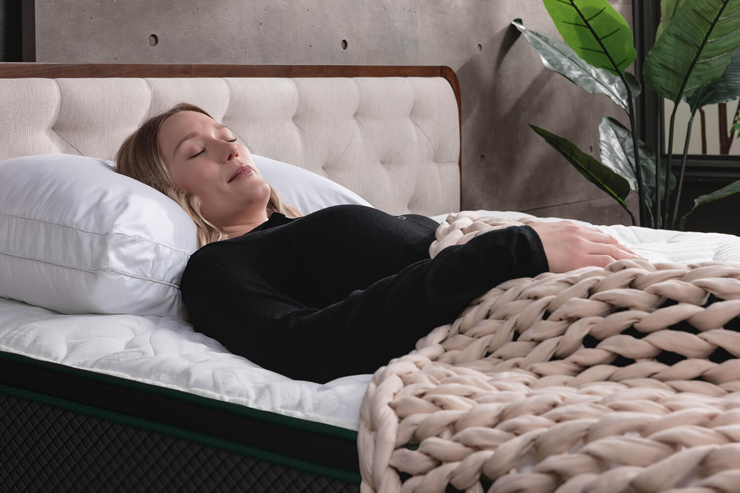 Woman sleeping on her back on a Logan &amp; Cove Adjustable Memory Foam Pillow
