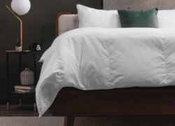 Logan & Cove Down Duvet on a bed with decorative pillows