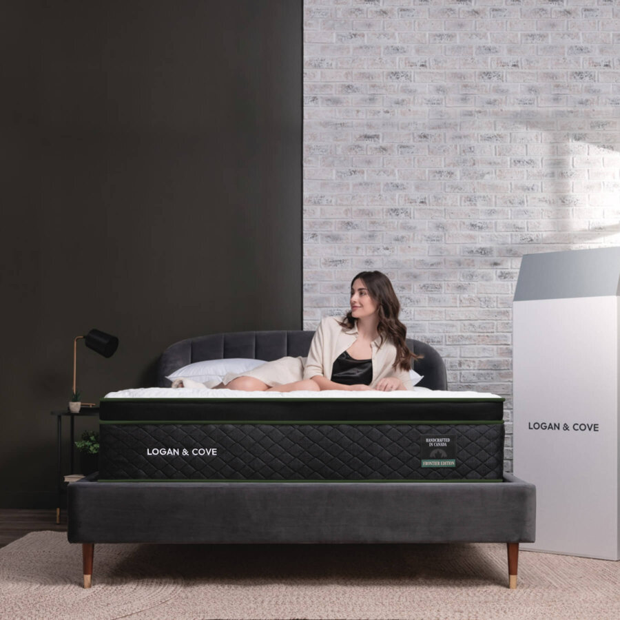 The Logan & Cove Frontier mattress with a beautiful woman lying on top