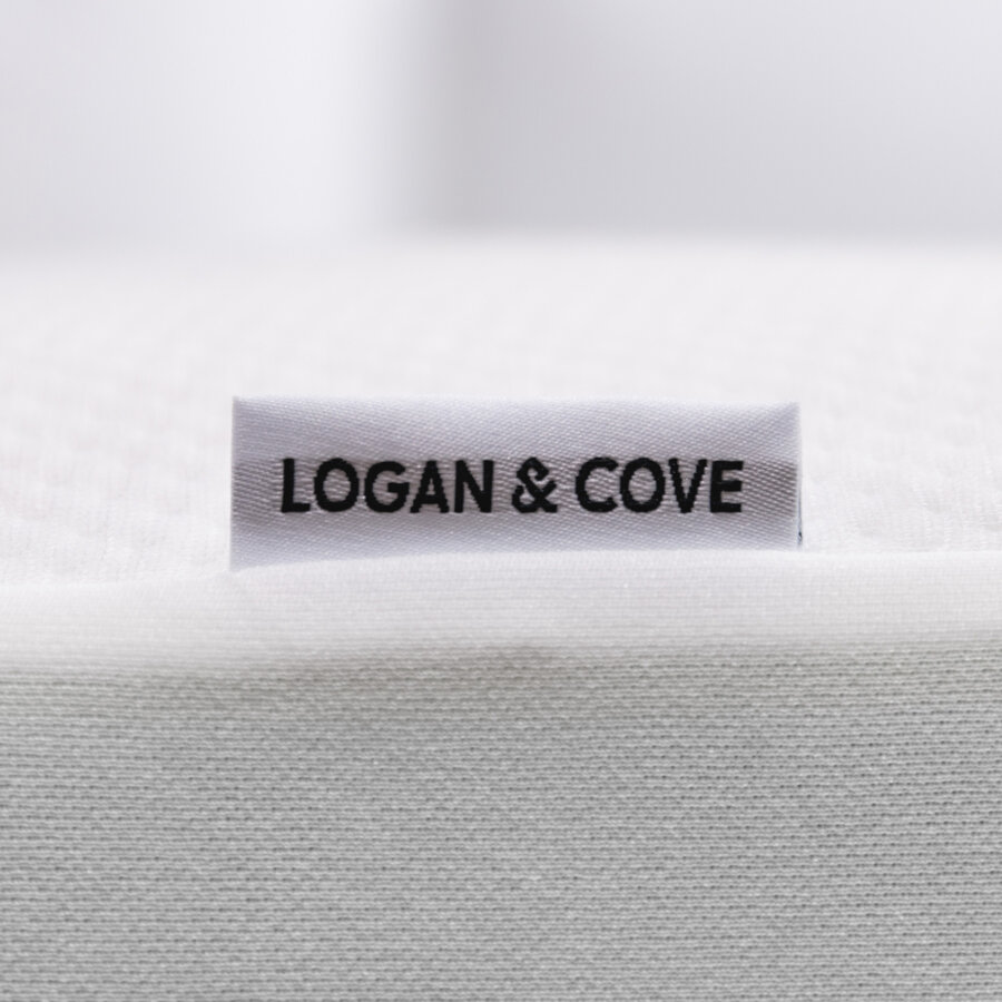 Close-up of Logan & Cove Mattress Protector brand tag