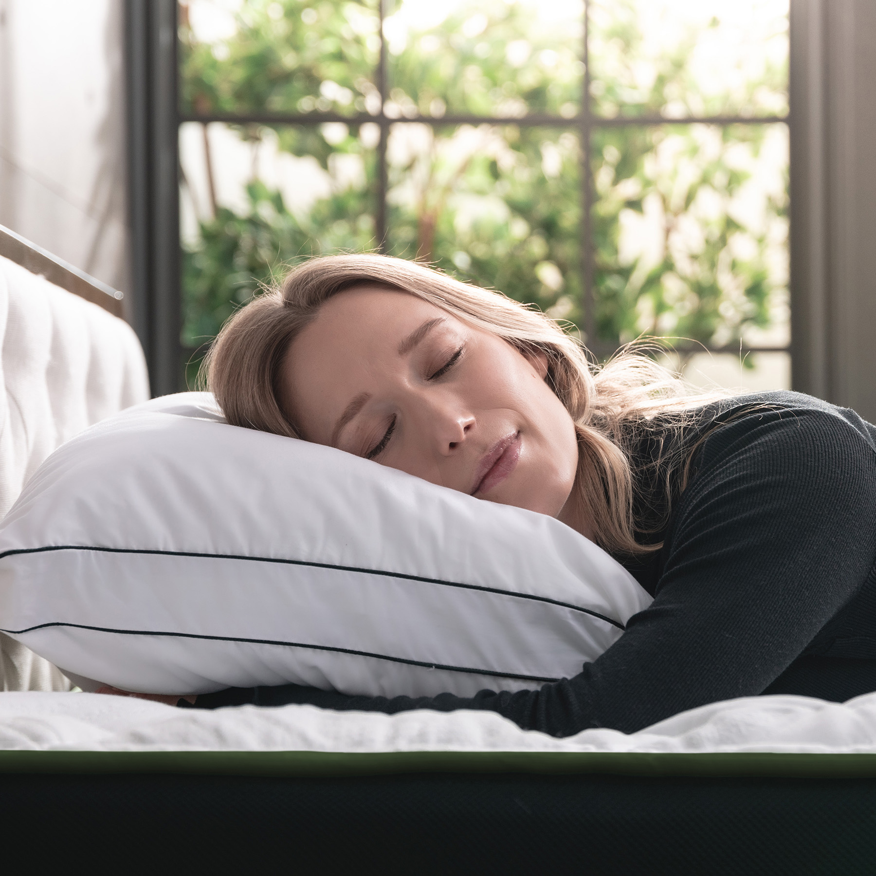 LC-Memory-Foam-Pillow-Carousel-4 Woman sleeping on her stomach on a Logan & Cove Adjustable Memory Foam Pillow