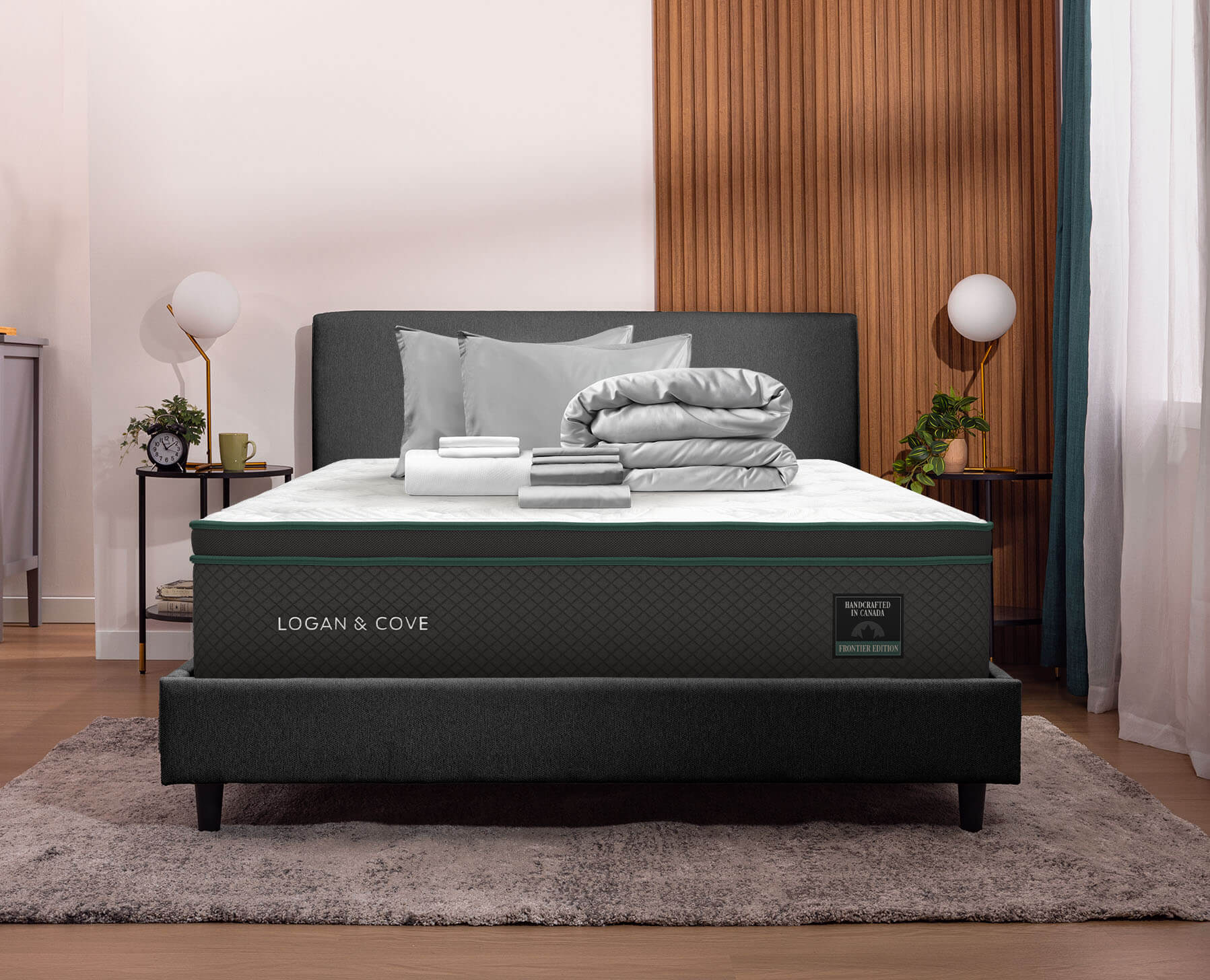 A grey premium sleep bundle sits neatly folded on a Logan and Cove Frontier Mattress