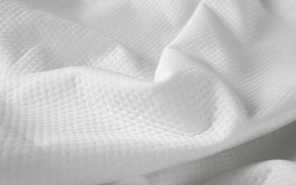 Close-up view of the mattress protector's fabric