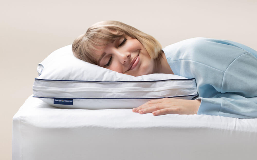 memory-foam-pillow-stomach-1000x625 Woman in light blue pajamas peacefully sleeping on her side, head resting on the Adjustable Memory Foam Pillow